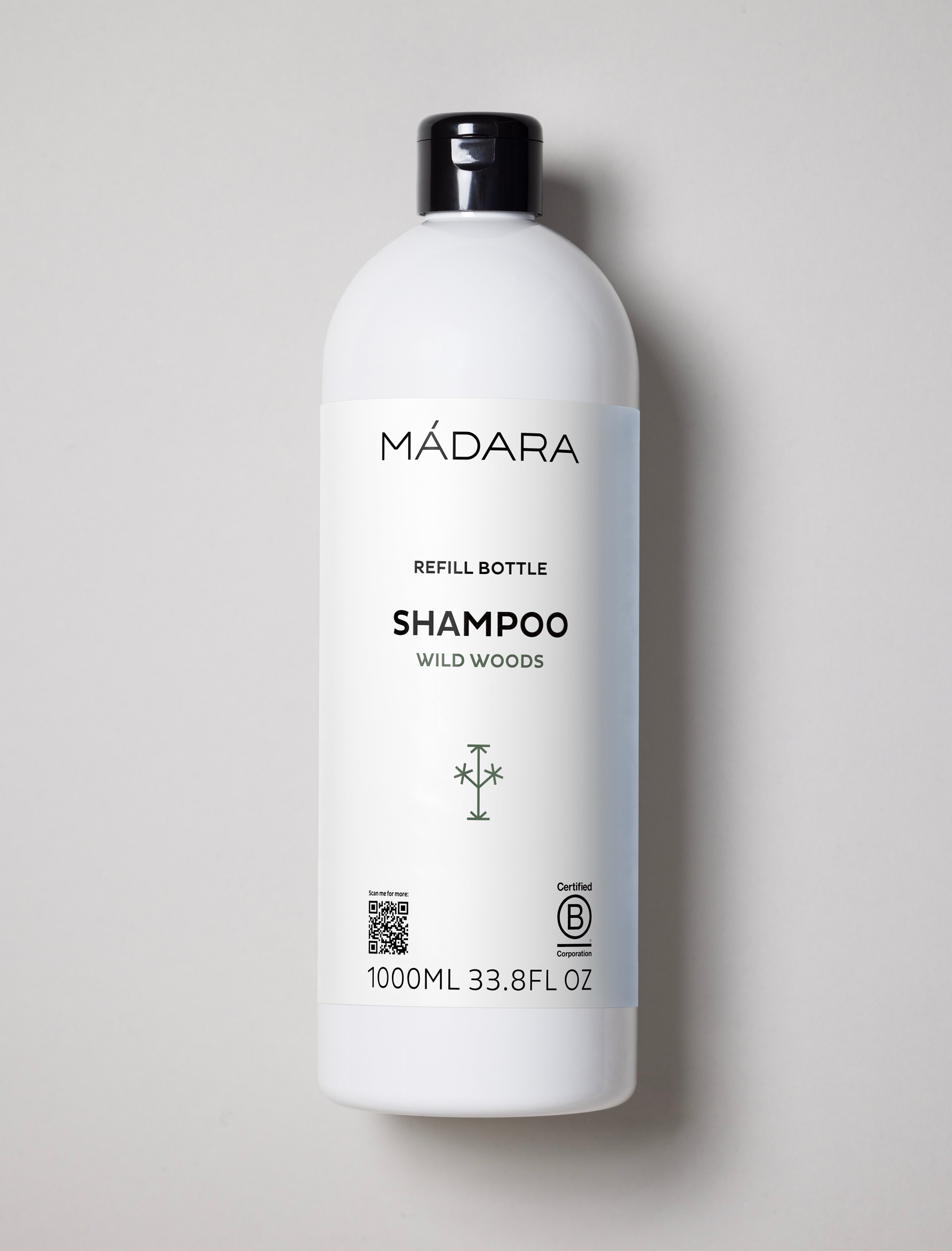 Mádara refill bottle of shampoo on a light gray background