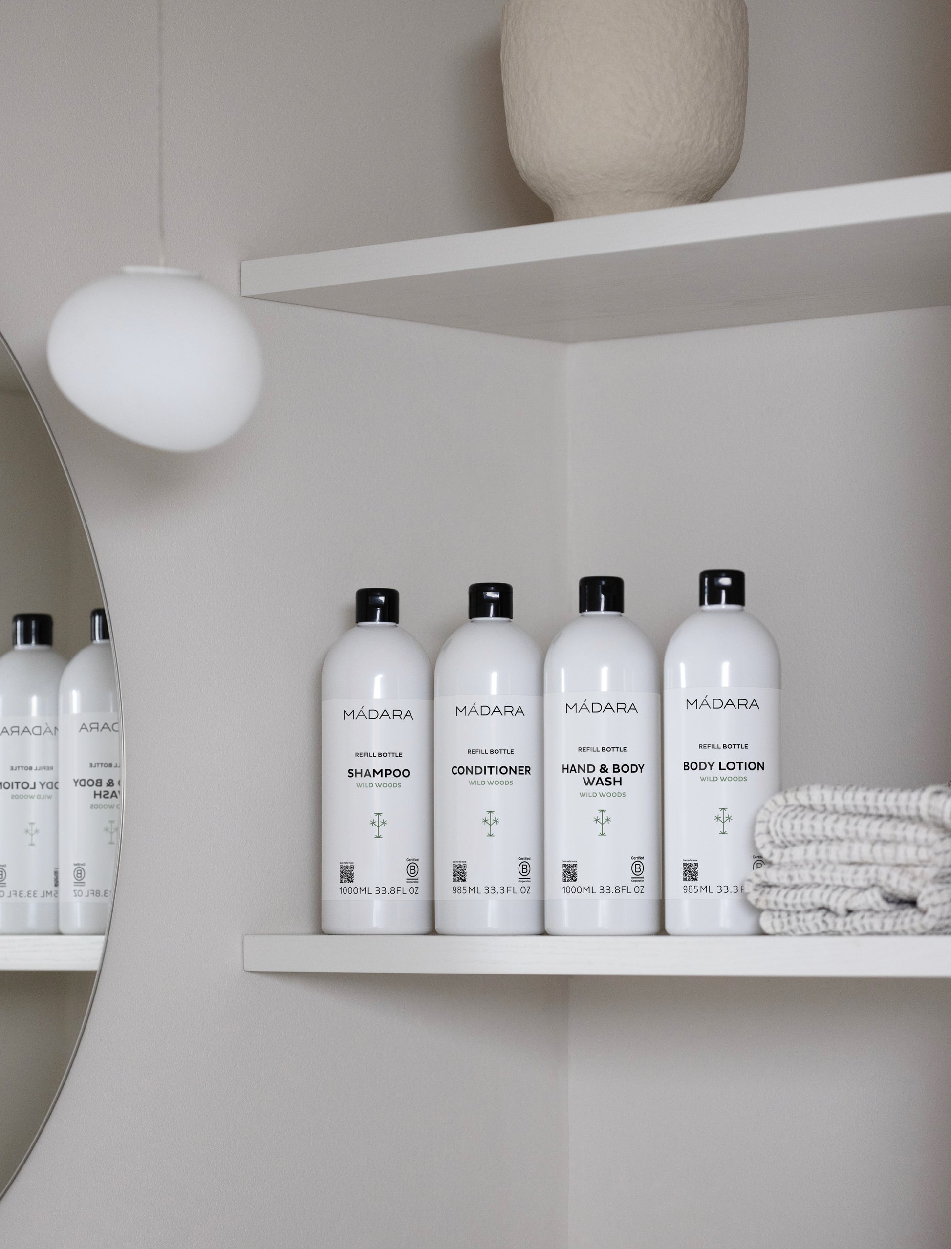 Set of Madara skincare products on a shelf in a bathroom setting