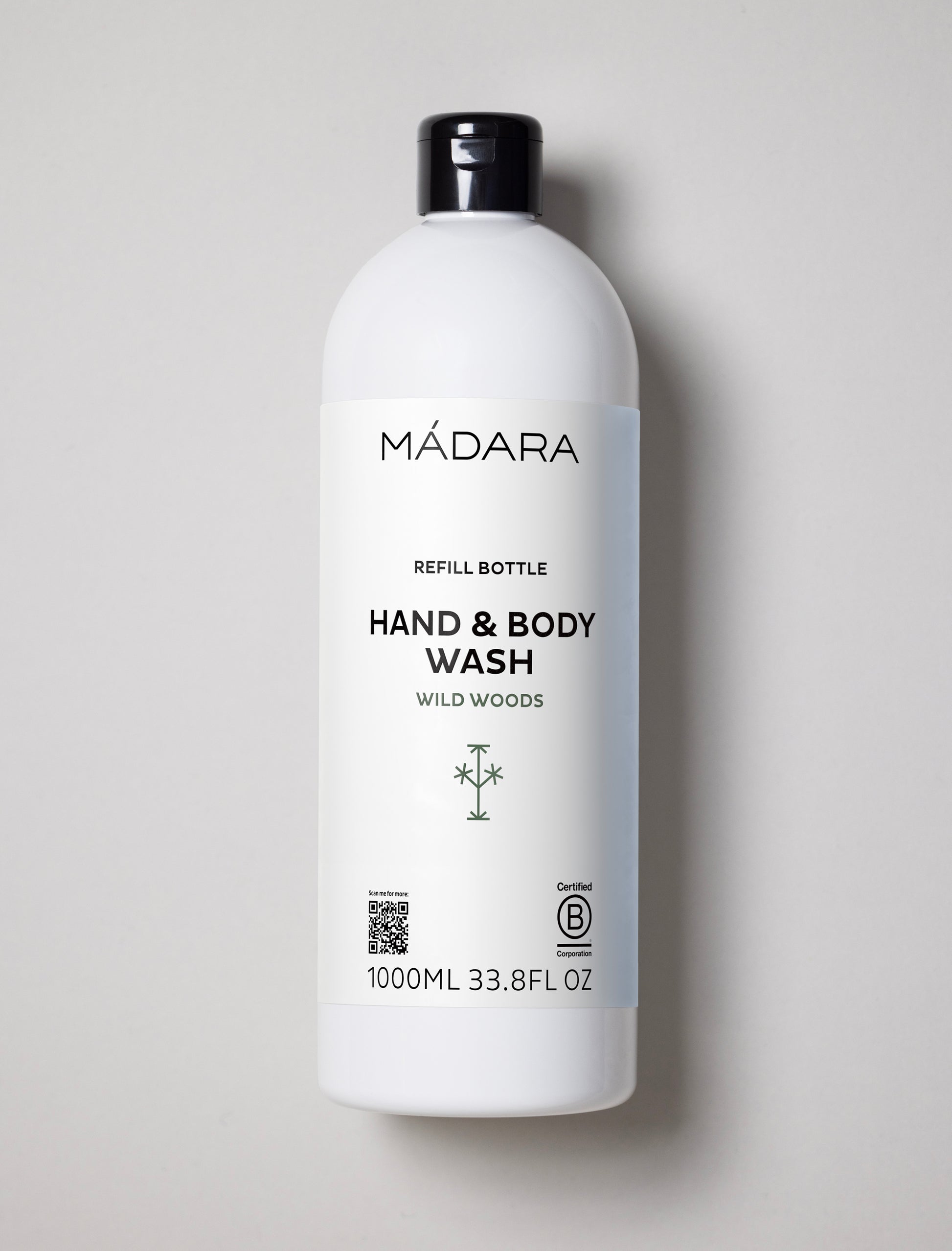 Mádara hand and body wash bottle on a light gray background
